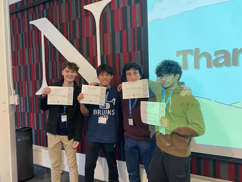 Picture of me (John O'Meara), Berkan, Aditya, and Ian after our HackPNW victory.